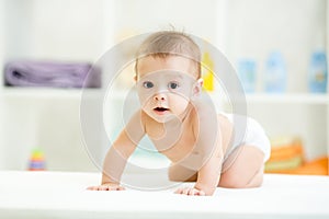 Cute smiling baby in diaper or nappy
