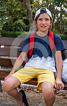 Cute smiling boy in a hat looking at the camera