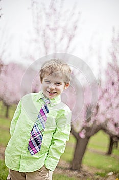 Cute smiling boy wearing tie in Spring