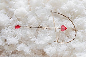 Cute smiling caucasian baby cupid on white clouds background with bow and heart arrow. Happy Valentines day concept.