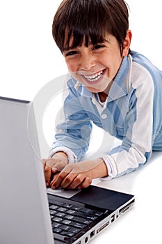 Cute smiling caucasian kid with laptop