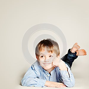 Cute Smiling Child. Little Boy Dreaming and Looking Up