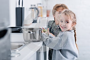 cute smiling childen cooking together