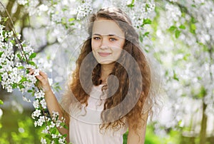 Cute smiling girl outdoors, sunny spring portrait