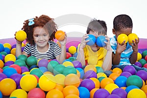 Cute smiling kids in sponge ball pool