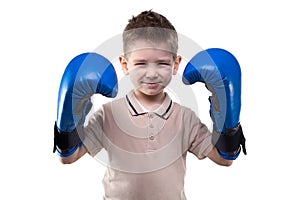 Cute smiling little boy with boxing gloves