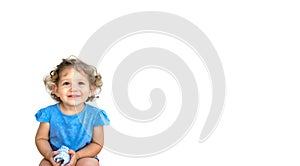 Cute smiling little girl looking thoughtful isolated against a white background