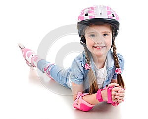 Cute smiling little girl in pink roller skates