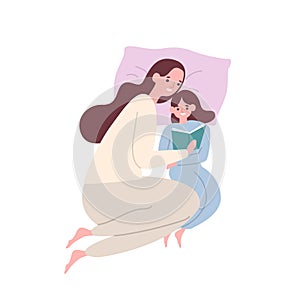 Cute smiling mother and daughter in pyjamas lying in bed and reading book or fairytale. Happy adorable mom and child