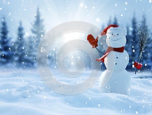 Cute smiling snowman with red scarf and hat with a broom in his hand.Winter fairytale.Merry christmas and happy new year greeting