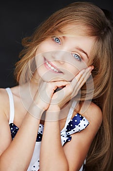Cute smilling girl with blue eyes.