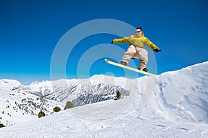 Cute snowboard man jumping