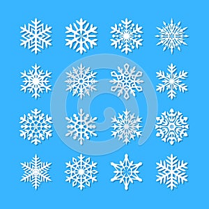 Cute snowflake collection isolated on blue background. Flat snow icons, snow flakes silhouette. Nice snowflakes for christmas