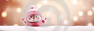 A cute snowman on blurred peach fuzz background. Winter holiday banner for Christmas greetings, announcements or