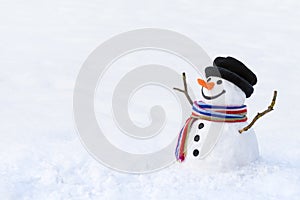 Cute snowman in deep snow