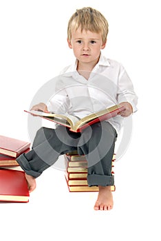 Cute and studious toddler reads outloud