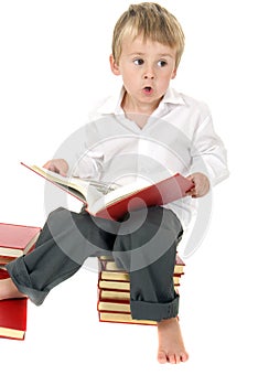 Cute and studious toddler reads outloud