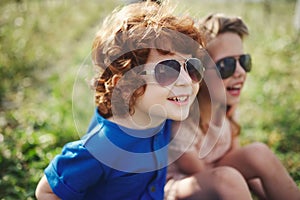 Cute stylish children in summer park