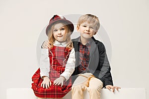Cute stylish children on white studio background