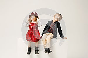 Cute stylish children on white studio background