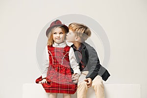 Cute stylish children on white studio background