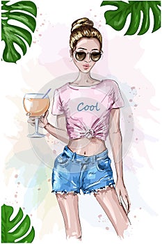 Cute stylish girl in crop top. Summer look. Fashion woman holding cocktail drink glass. Sketch. Summer set with green leaves.