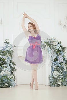 Pretty woman plus size in purple cute lingerie dress babydoll style on white studio room background alone. full length