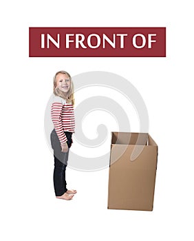 Cute and sweet blond hair child standing in front of cardboard box learning English card set