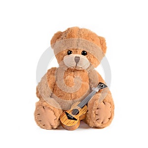Cute Teddy bear with a guitar Isolated white background