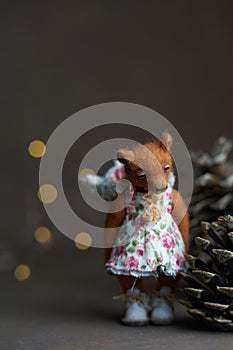 Cute teddy bear  on light background. Holiday glowing backdrop. Defocused background with blinking light