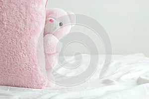 Cute teddy bear play hides and seeks with square pillow