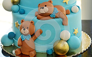 Cute teddy bears on bithday cake.