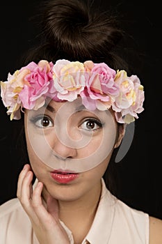 Cute teen girl close up wearing a floral headband