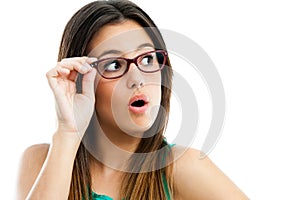 Cute teen girl with glasses looking aside.