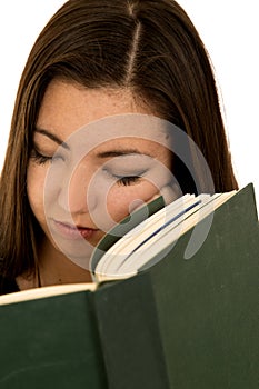 Cute teen girl sleeping not reading her book close up