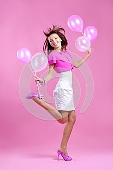 Cute teenage girl with balloons