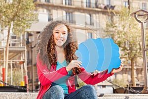 Cute teenage girl with blanked speech cloud