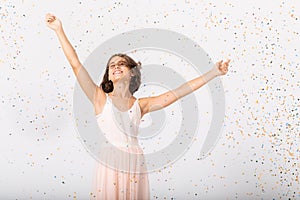 Cute teenage girl jumping the empty room, copy space on the white wall