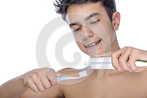 Teen boy wearing braces on white background