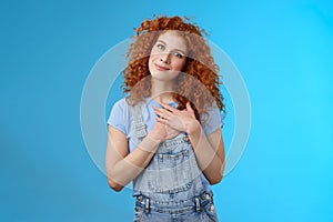 Cute tender attractive redhead curly girl cherish romantic feelings thankful pleasant gift touch heart press palms chest