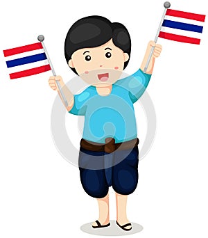 Cute Thai boy in traditional clothes holding thai flag