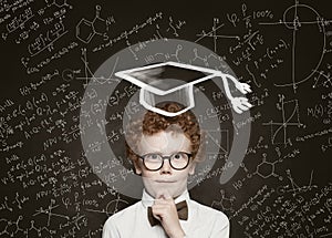 Cute thinking little boy student on science background, vintage retro tonned portrait