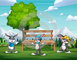 Cute three bunnies cartoon in the park landscape