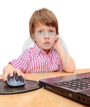 Cute three years boy with laptop isolated on white