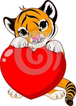 Cute tiger cub holding heart