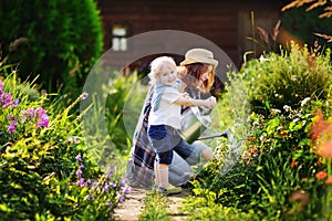 Cute toddler boy and his mat summer sunny day