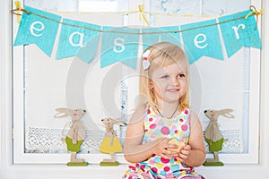 Cute toddler girl with easter decoration