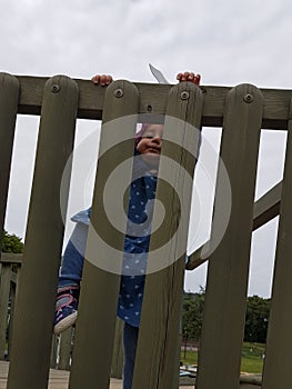 Cute toddler with pink hat and blue dress