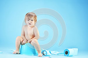 Cute toddler on potty chait photo