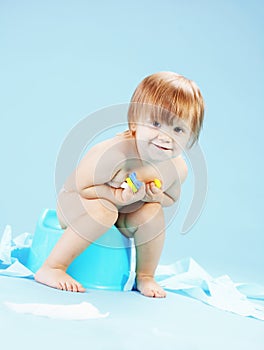 Cute toddler on potty chait